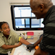 Tyshuanna Jackson gets her blood drawn for HIV/AIDS and STD testing by Ernest Johnson of John Wesley Community Health Institute on June 5, 2013, in Los Angeles. (Kevork Djansezian/Getty Images)